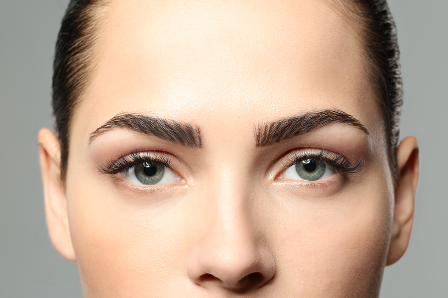 Young woman with beautiful eyebrows, closeup