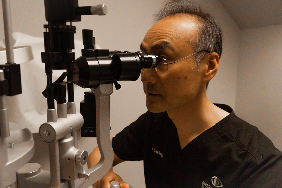 Dr. Yi performing eye exam